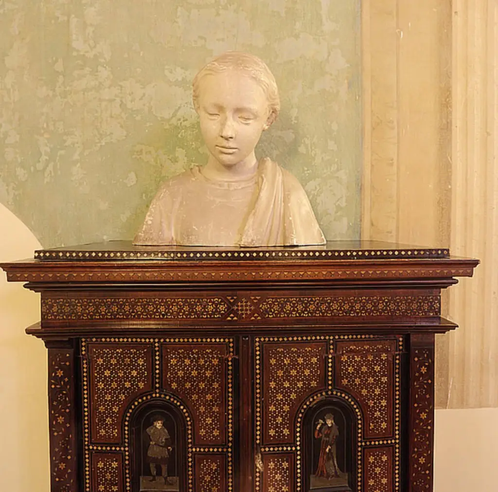 Marble bust on an inlaid antique cabinet