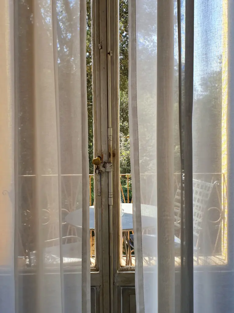 Sheer curtains at a window over the garden
